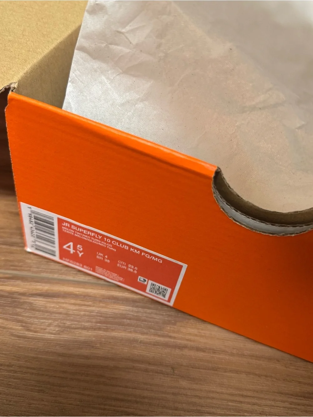 Nike Kids Orange Soccer Cleats with Blue Swoosh